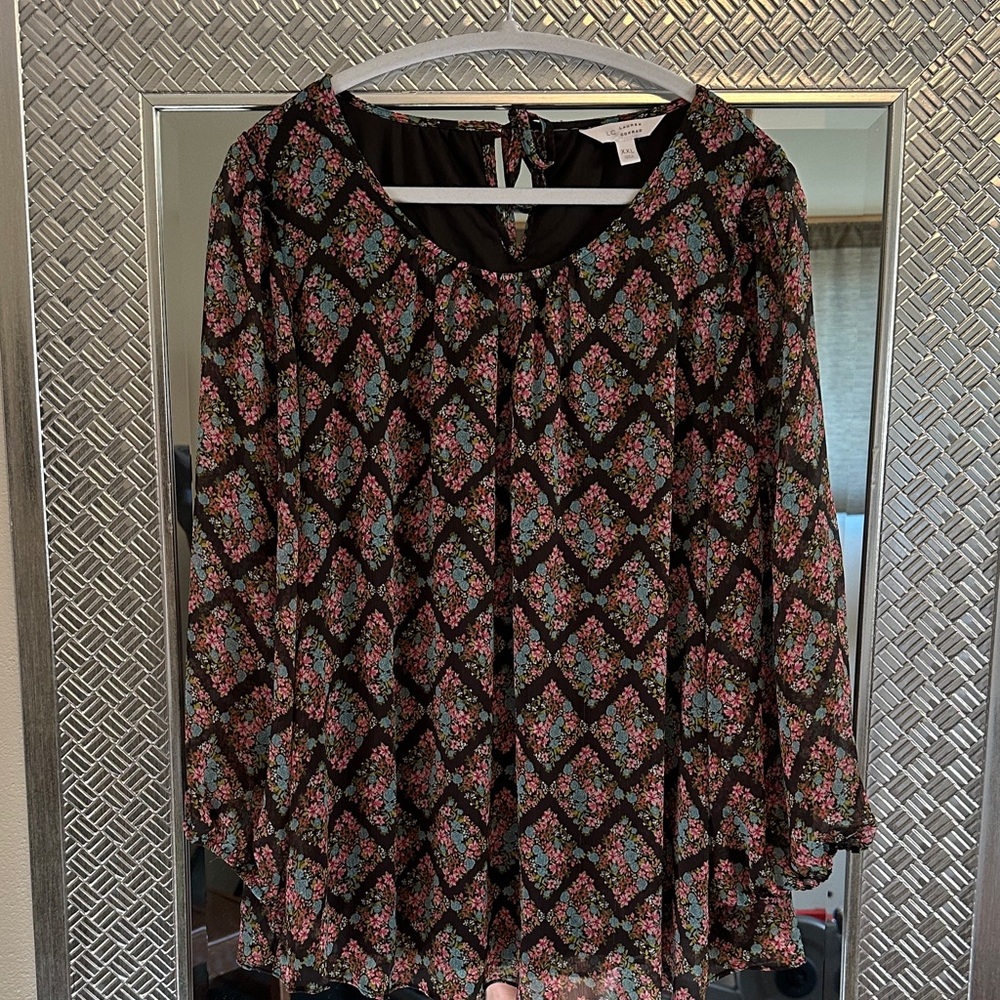 Very pretty floral blouse.  Lined bodice.